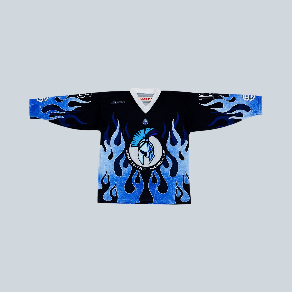 Maillot de hockey Saison Spartiates Marseille bleu avec motif de flammes et logo de casque spartiate