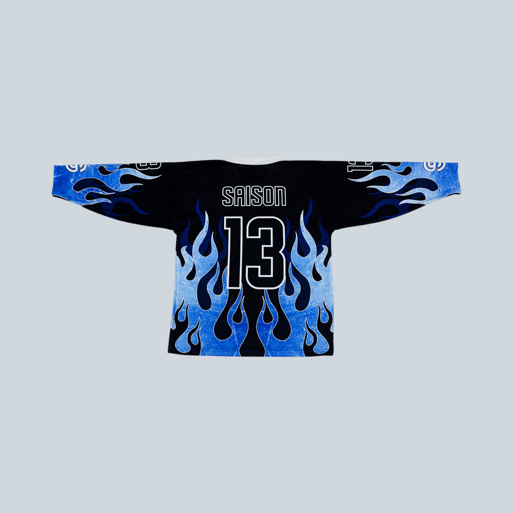Maillot de hockey Saison x Spartiates bleu avec motif de flammes et numéro 13 au dos