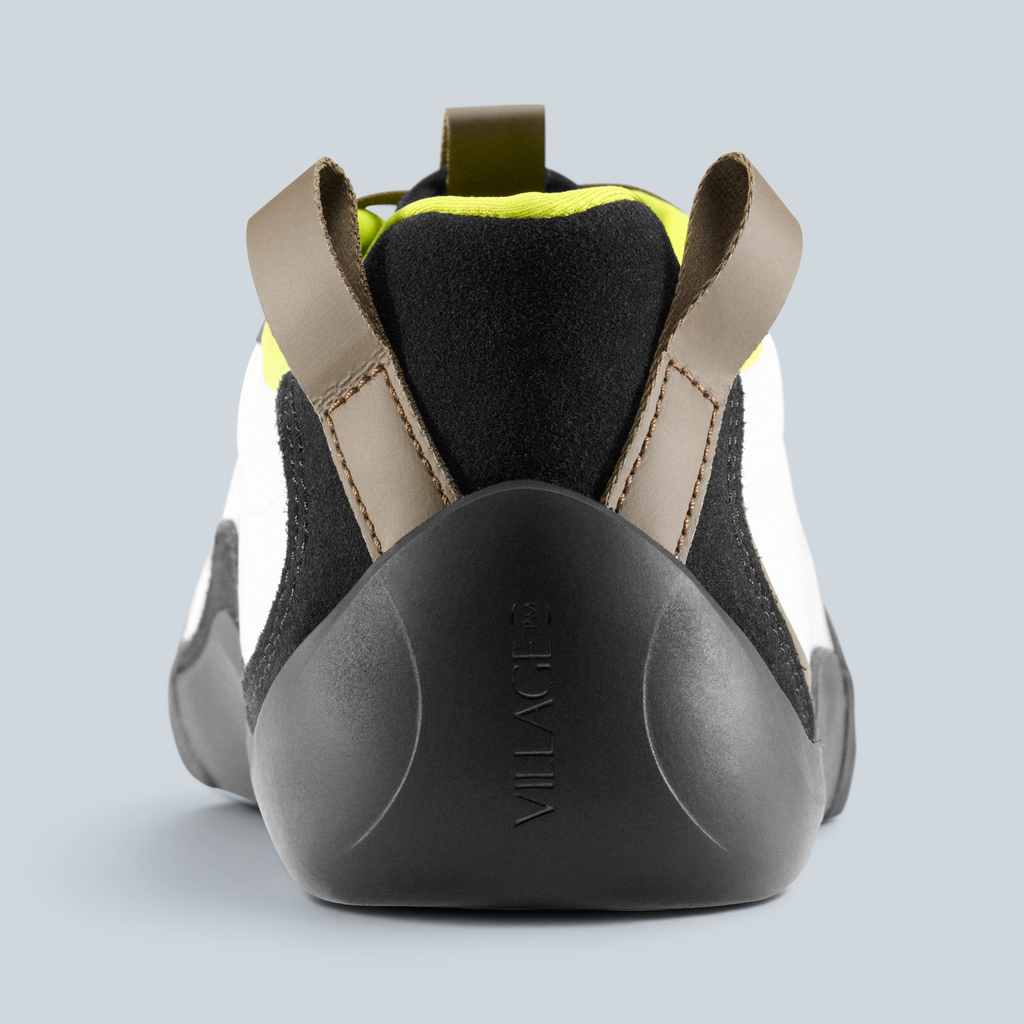 Vue arrière de la basket basse Saison 2PM en cuir synthétique blanc, noir et détails vert lime
