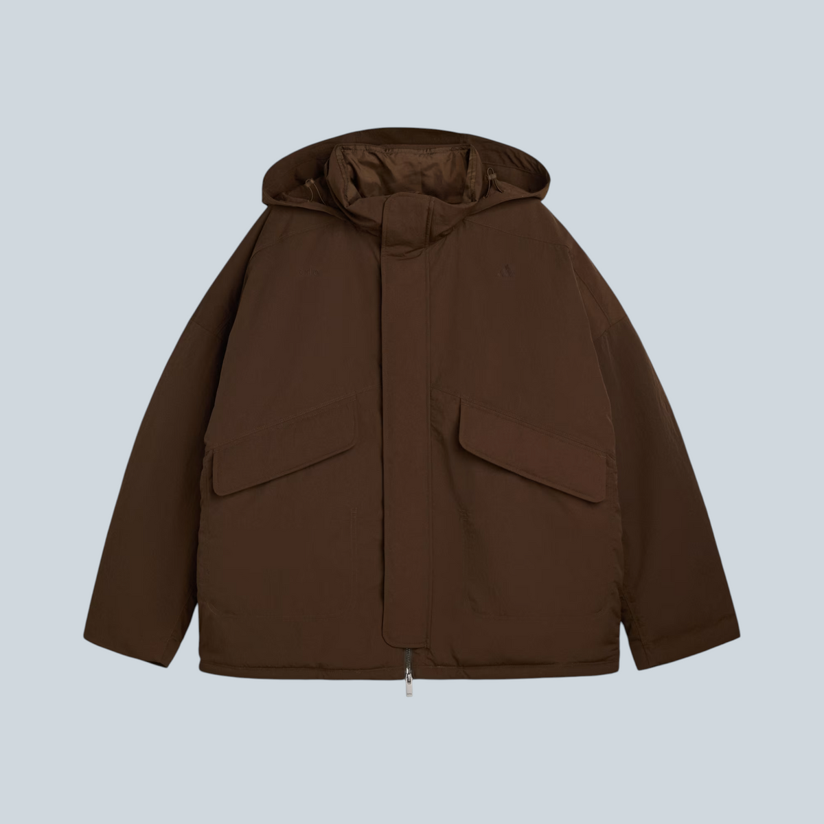 Manteau puffer Saison adidas x Arte couleur marron dust cargo avec capuche et grandes poches avant