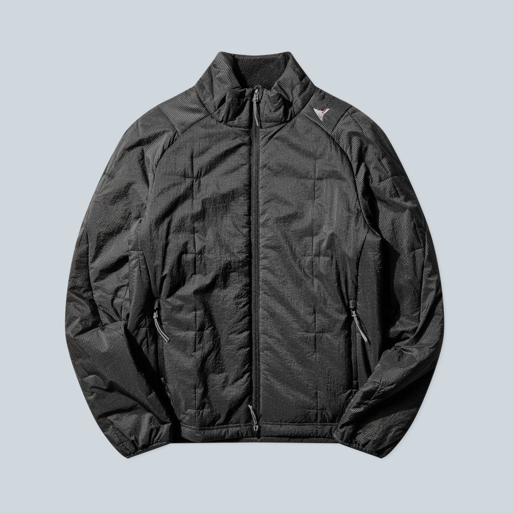 Veste isolante technique noire Saison Merapi avec matelassage synthétique, col montant et fermeture zippée