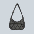 Sac pliable matelassé noir Saison Nuna en toile polyamide avec bandoulière confortable et design léger
