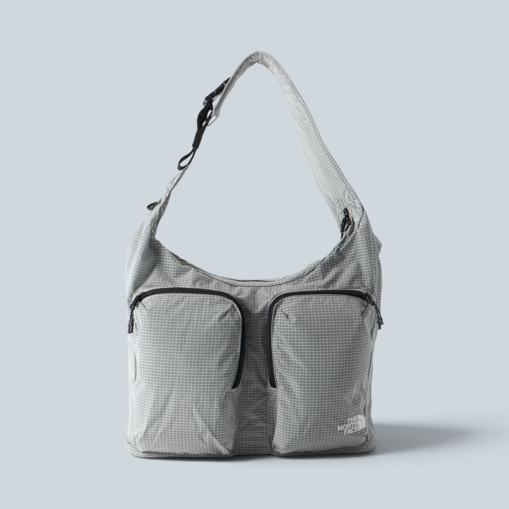 Sac cabas Saison The North Face Never Stop gris à motif quadrillé avec deux poches frontales zippées