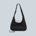 Sac noué pliable Saison Laki en toile polyamide noire avec bandoulière réglable et logo discret