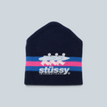 Bonnet Stüssy Stripe Ski bleu marine en acrylique avec logo imprimé et rayures roses et bleues chez Saison