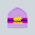 Bonnet Stüssy Stripe Ski violet en acrylique avec logo jaune et bandes contrastées, disponible chez Saison
