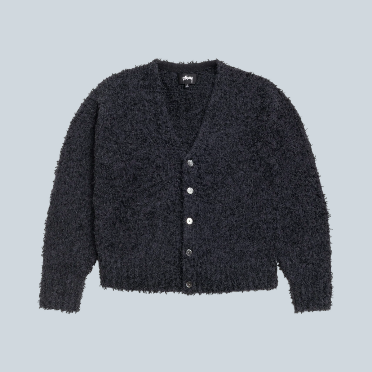 Cardigan texturé noir Stüssy en mélange de laine et alpaga avec fermeture boutonnée, disponible chez Saison
