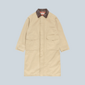 Manteau duster Stüssy couleur kaki en coton avec col contrastant marron, proposé par Saison