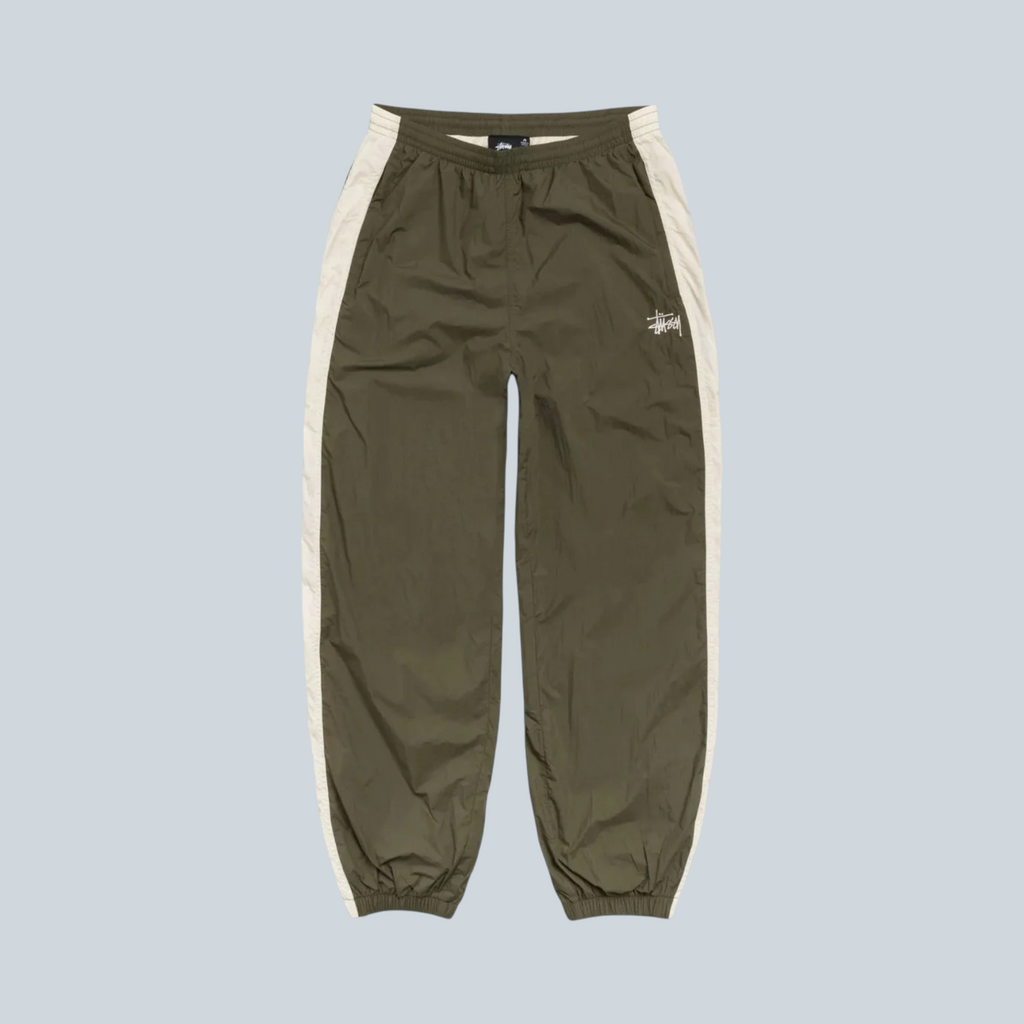 Pantalon de jogging Saison Stüssy en nylon olive avec bandes latérales contrastantes et logo brodé