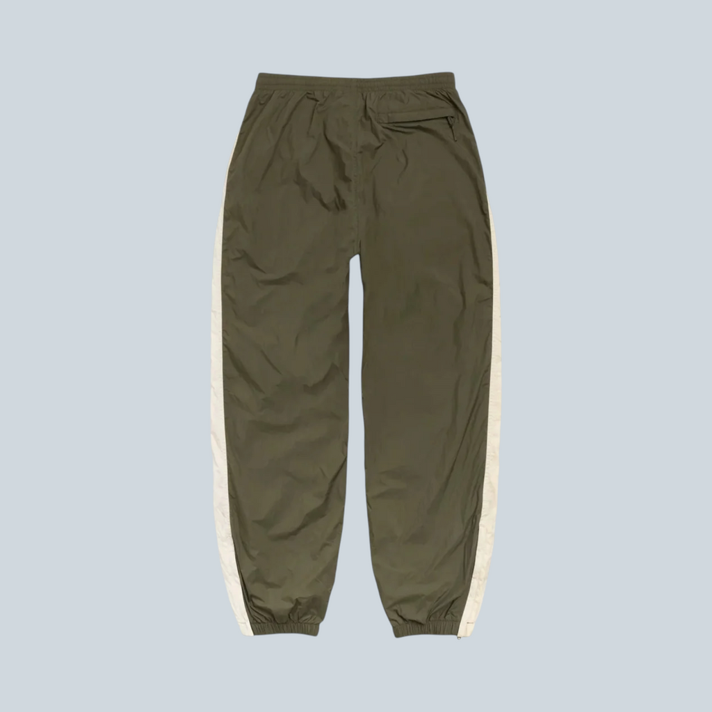 Pantalon de survêtement Stüssy Saison olive en nylon avec bandes latérales contrastées et taille élastique
